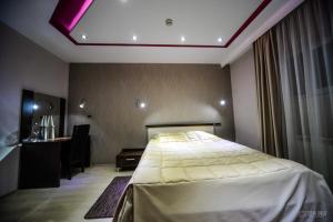 เตียงในห้องที่ Garni Hotel 018 In