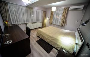 เตียงในห้องที่ Garni Hotel 018 In