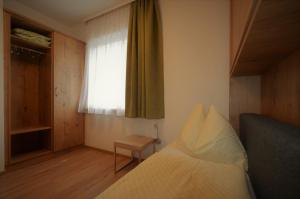 Łóżko lub łóżka w pokoju w obiekcie Appartements-Pension Lindenheim