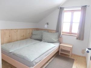 Säng eller sängar i ett rum på Ferienhaus Gaiswinkler