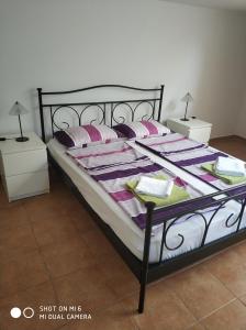 Posteľ alebo postele v izbe v ubytovaní Apartments Nogic