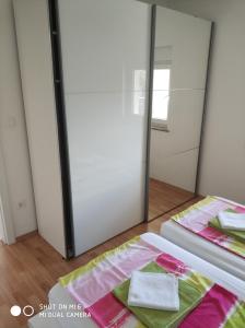 Posteľ alebo postele v izbe v ubytovaní Apartments Nogic