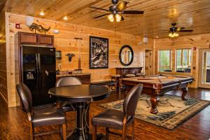 a game room with a pool table and ping pong ball at Greenbrier Estate in Pittman Center