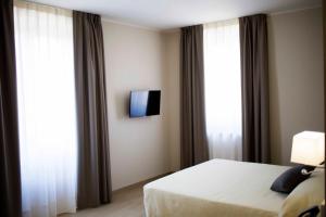 Krevet ili kreveti u jedinici u objektu Hotel Palazzo Salerno