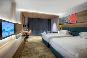 Voodi või voodid majutusasutuse Emerald Hotel toas