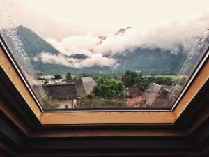 a window with a view of a mountain at Apartma 10th Mountain, Bovec in Bovec