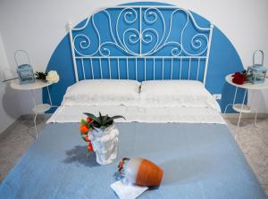 Posteľ alebo postele v izbe v ubytovaní L' Arena Suite - Sicilian style 140 mq flat with balcony and Arena seeview