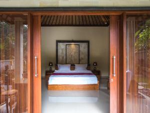 Letto o letti in una camera di Bali Jungle Resort