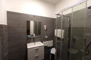 Koupelna v ubytování Albergo Le Sorgenti + 37 fotografií