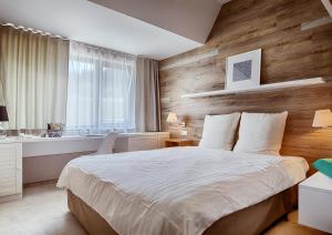 Posteľ alebo postele v izbe v ubytovaní Cihelny Golf & Wellness Resort