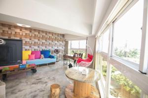 a living room with a couch and a tv at 阜東樓 in Tainan