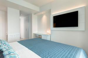 Postel nebo postele na pokoji v ubytování Lloyd's Baia Hotel