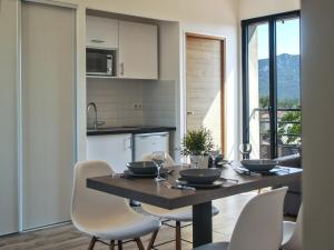a kitchen with a table and chairs in a kitchen at Villa St Ange in Gémenos