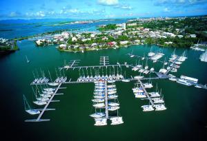 an aerial view of a marina with boats in the water at Résidence Turquoise Guadeloupe - Vue mer et lagon in Le Gosier