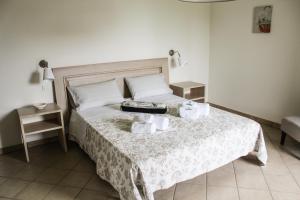 Posteľ alebo postele v izbe v ubytovaní B&B al Doremi