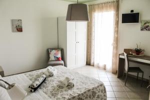 Posteľ alebo postele v izbe v ubytovaní B&B al Doremi