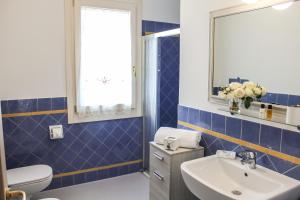 Kúpeľňa v ubytovaní B&B al Doremi + 36 fotografií
