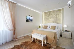 Giường trong phòng chung tại Kroshka Enot Hotel