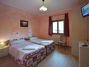 Cama o camas de una habitación en Rifugio Fedaia