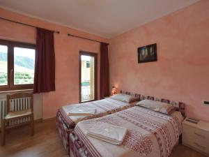 Een bed of bedden in een kamer bij Rifugio Fedaia