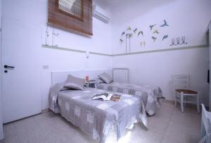 Postel nebo postele na pokoji v ubytování Il Ghiro Guest House