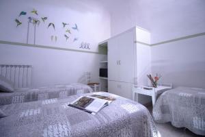 Postel nebo postele na pokoji v ubytování Il Ghiro Guest House