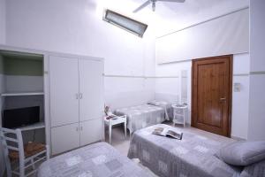 Postel nebo postele na pokoji v ubytování Il Ghiro Guest House