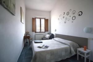 Postel nebo postele na pokoji v ubytování Il Ghiro Guest House