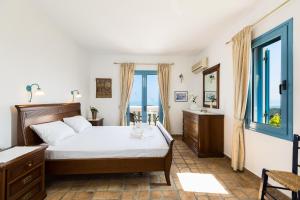 Postel nebo postele na pokoji v ubytování Villa Ariadne