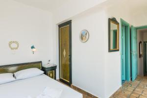 Postel nebo postele na pokoji v ubytování Villa Ariadne + 21 fotografií