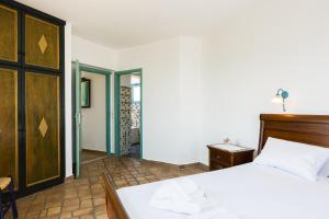 Postel nebo postele na pokoji v ubytování Villa Ariadne