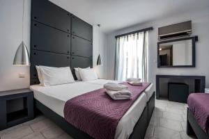 Postel nebo postele na pokoji v ubytování Galaxy Hotel + 37 fotografií