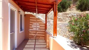 a walkway with awning on the side of a building at Creta Spirit in Plakias