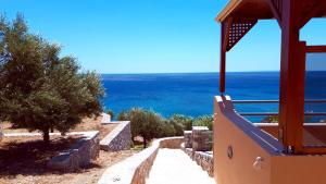 a view of the ocean from a balcony of a house at Creta Spirit in Plakias