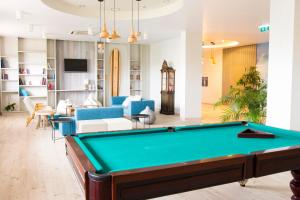 a living room with a pool table at Star inn Peniche in Peniche