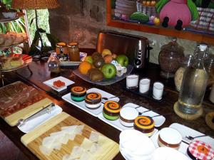 a table with a bunch of food on it at El Corral De Concilio in Concilio