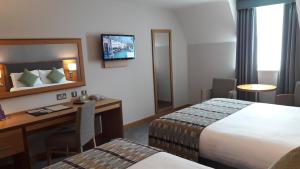 Krevet ili kreveti u jedinici u okviru objekta Westgrove Hotel