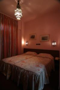 A bed or beds in a room at Hotel Chellah