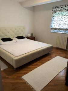 Apartment NEEA Stinjan -free parking tesisinde bir odada yatak veya yataklar