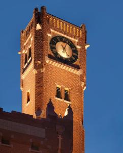 a clock tower on top of a brick building at ibis Styles Den Haag City Centre in The Hague