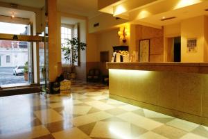 a lobby with a counter in a building at Pousada Palacio de Queluz in Queluz