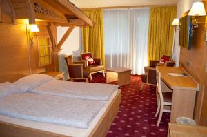 Postel nebo postele na pokoji v ubytování Hotel Central Résidence