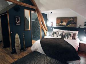 Ένα ή περισσότερα κρεβάτια σε δωμάτιο στο Aux 5 Sens