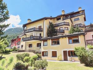 a building with balconies on the side of it at Corvatsch 3/47 in Silvaplana
