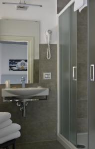 a bathroom with a shower and a sink at Hotel Panorama in Chianciano Terme