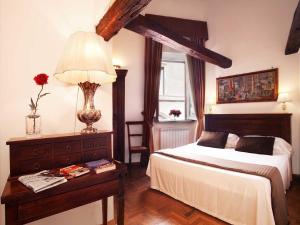 Postel nebo postele na pokoji v ubytování Pantheon Inn