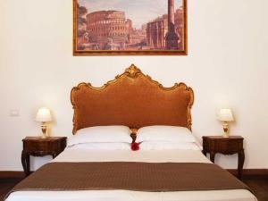 Postel nebo postele na pokoji v ubytování Pantheon Inn