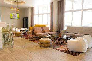 a living room with a couch and a table at Star inn Peniche in Peniche