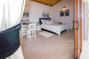 Ένα ή περισσότερα κρεβάτια σε δωμάτιο στο Estate Villa Duo