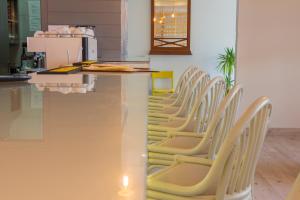 a row of chairs lined up at a counter at Star inn Peniche in Peniche